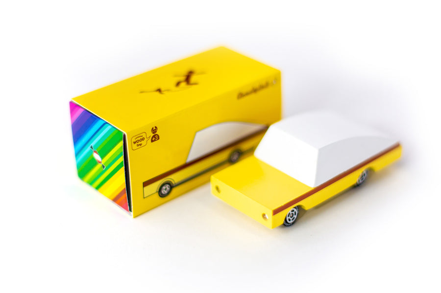 Candylab childrens yellow candycar toy on a white background next to its cardboard box