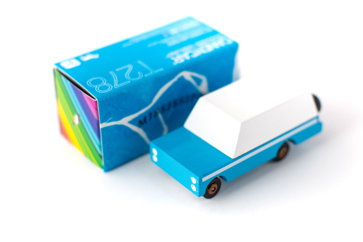 Candylab blue mule wooden car toy on a white background next to its blue box