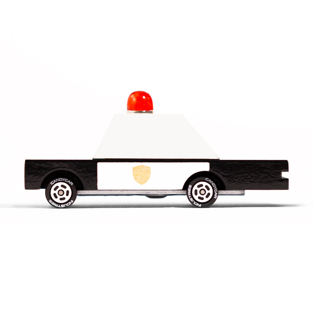 Candylab handmade solid wooden police car toy on a white background