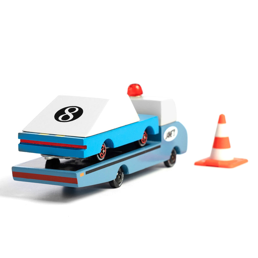 Candylab wooden toy tow truck with a blue car toy on the back