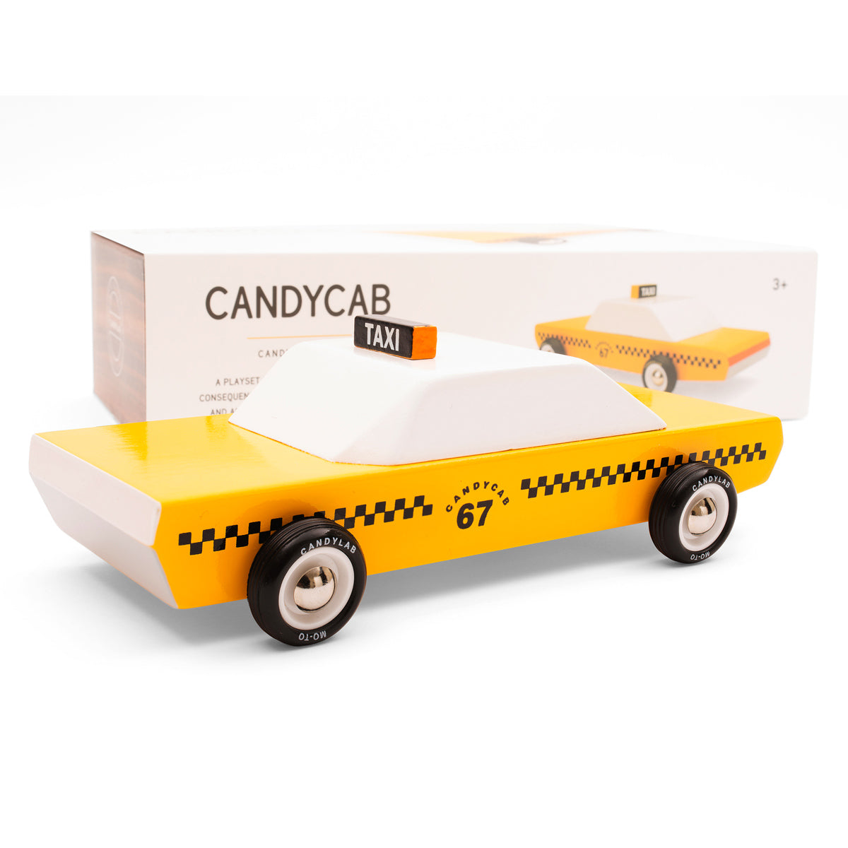 Candylab handmade wooden candycab yellow taxi toy on a white background in front of its cardboard box