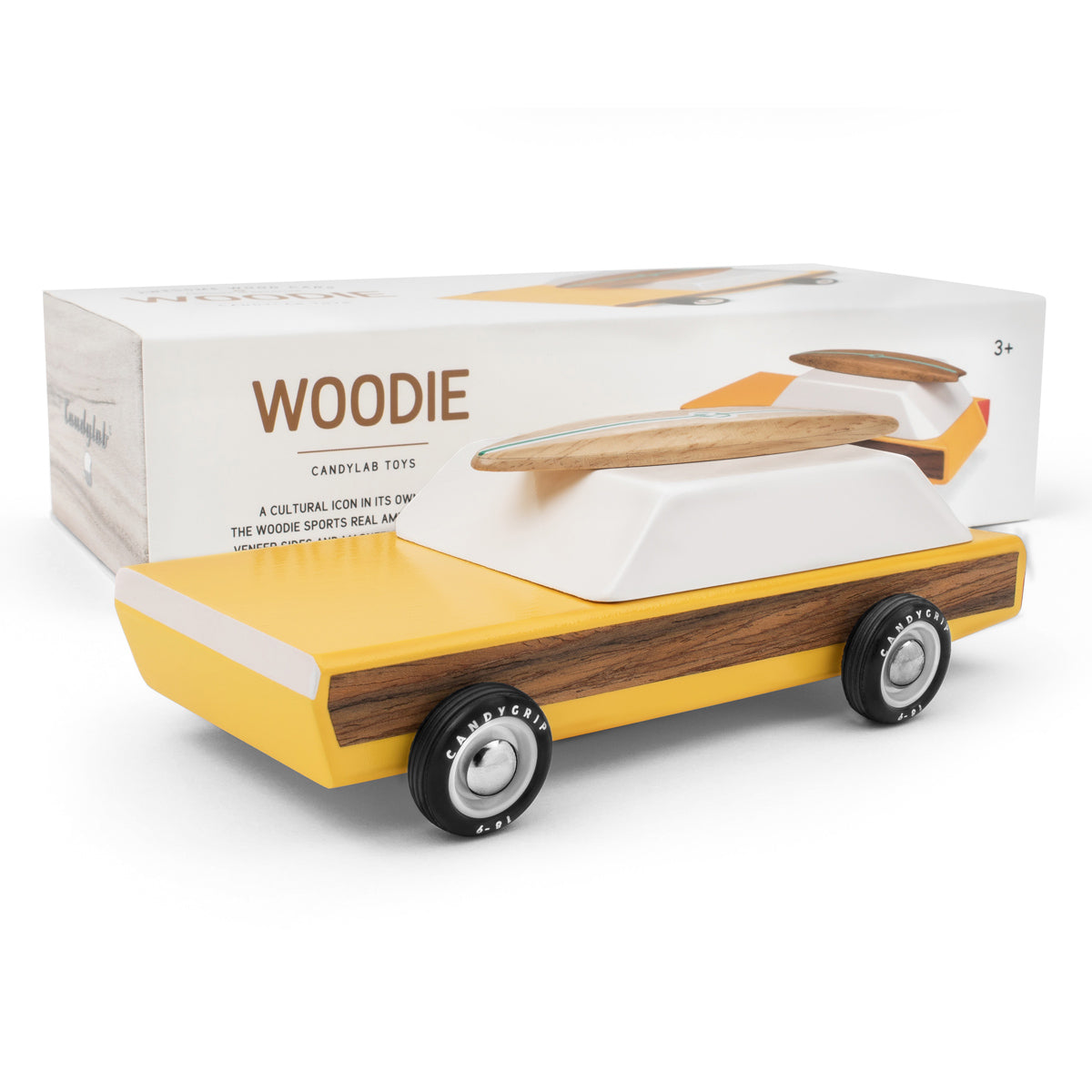 Candylab handmade wooden woodie car toy on a white background in front of its cardboard box