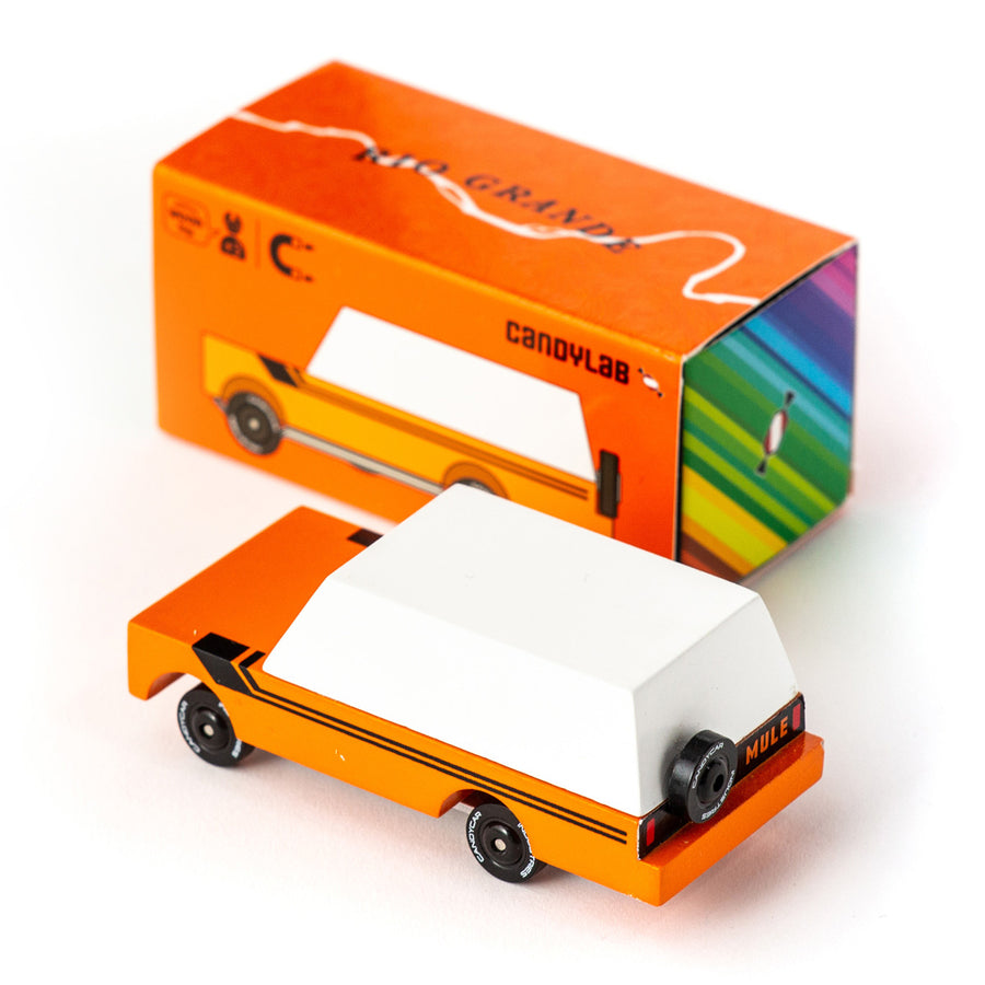 Candylab childrens handmade wooden grande mule car toy on a white background next to its orange cardboard box