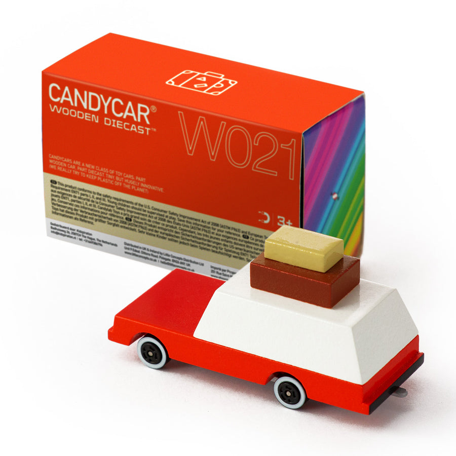 Candylab kids handmade wooden luggage wagon toy car on a white background next to its cardboard box