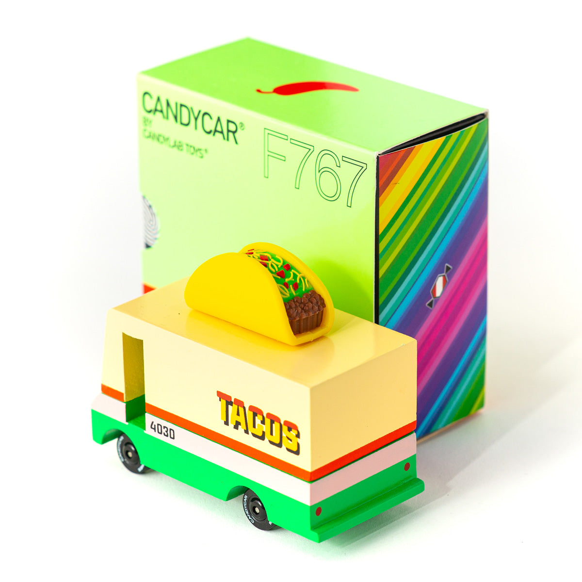 Candylab collectable taco van toy on a white background next to its cardboard packaging