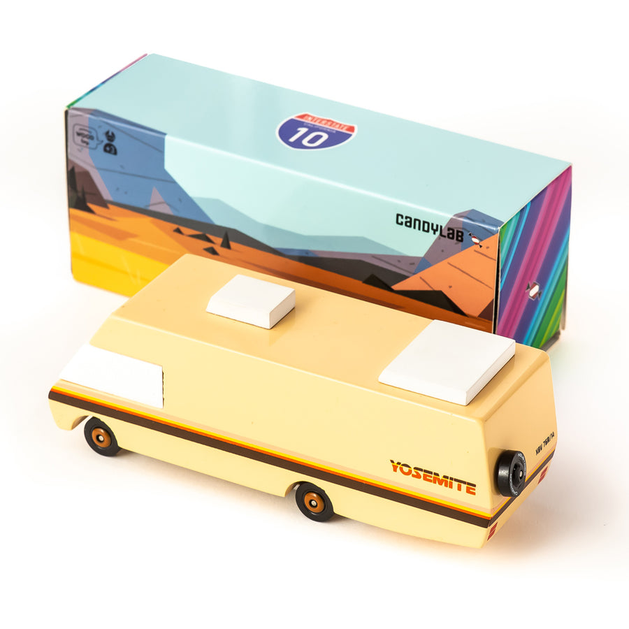 Candylab kids wooden Yosemite RV toy on a white background next to its cardboard box