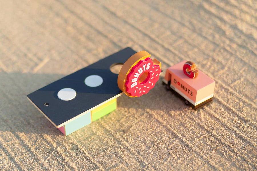 Close up of the Candylab toy donut shack on a sandy background