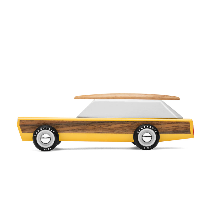 Side of the Candylab childrens handmade wooden woodie car toy on a white background