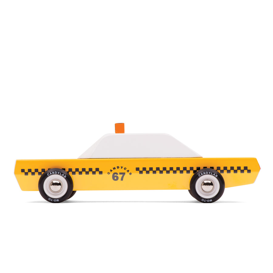 Side of the Candylab handmade wooden taxi candycar toy on a white background