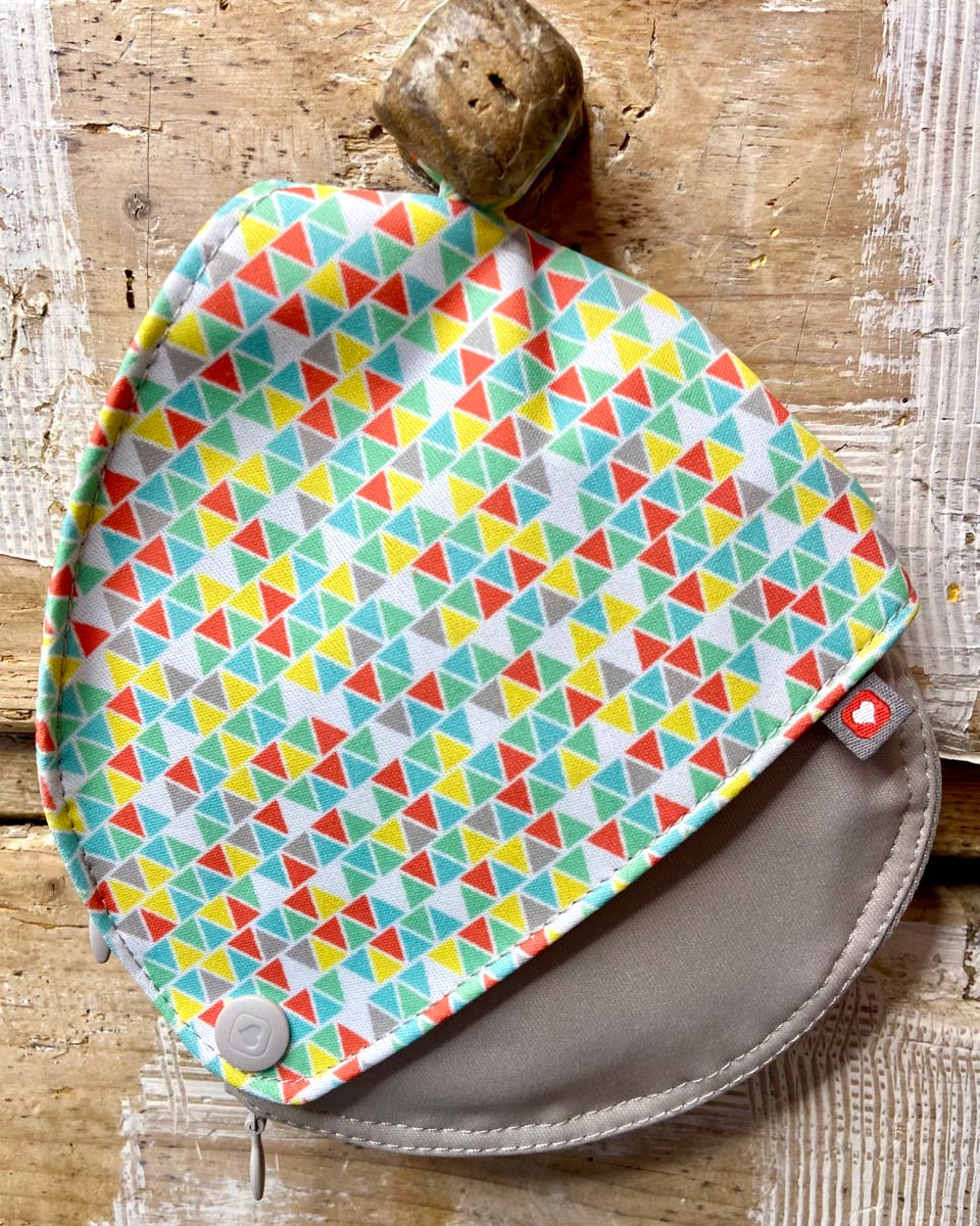 Close up of the Close breast feeding maternity pads pouch hanging on a wooden background