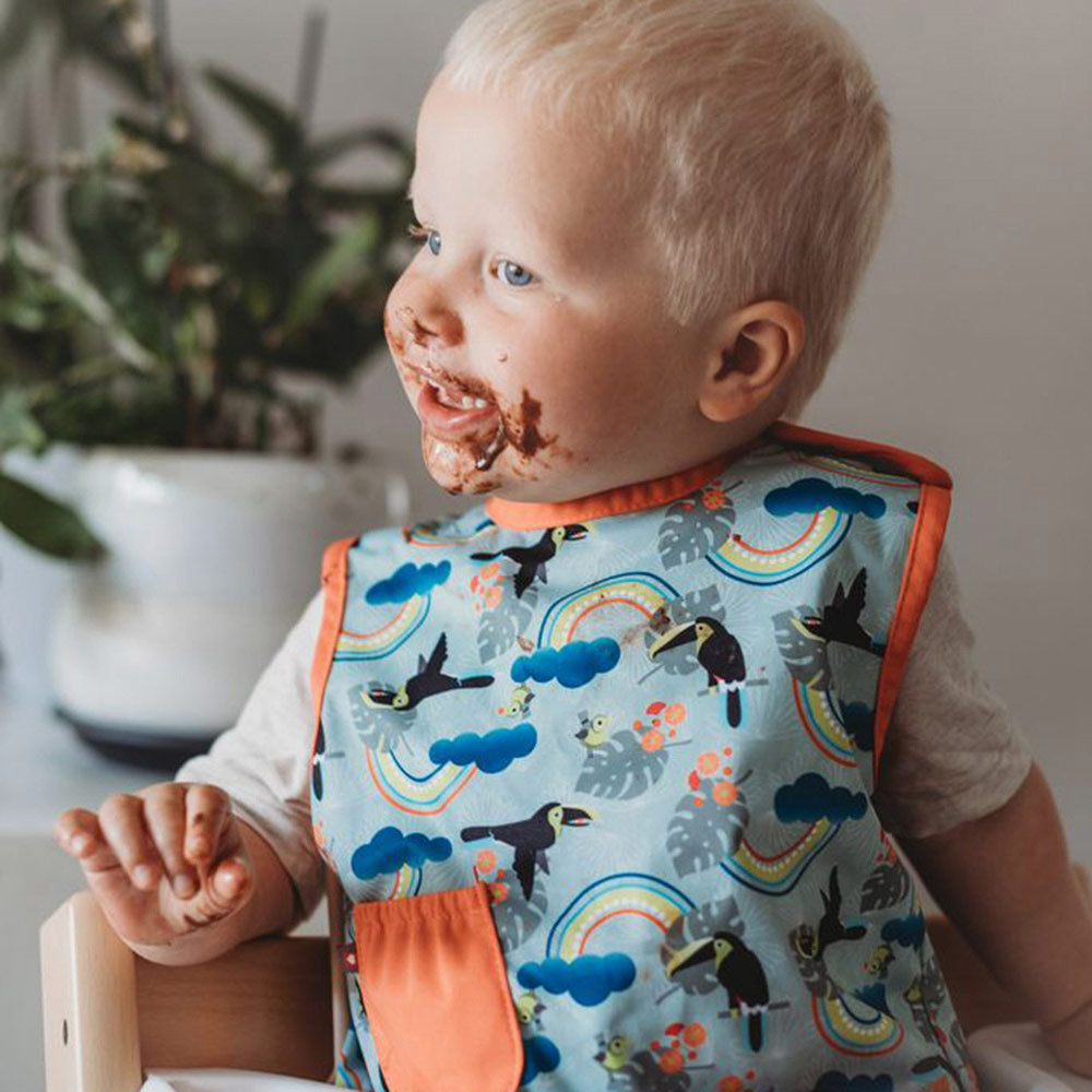 Close popin toucan sleeveless bib modelled by toddler