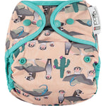 Pop-in light pink Ferret Popper Nappy Wrap with green trim details on a white background