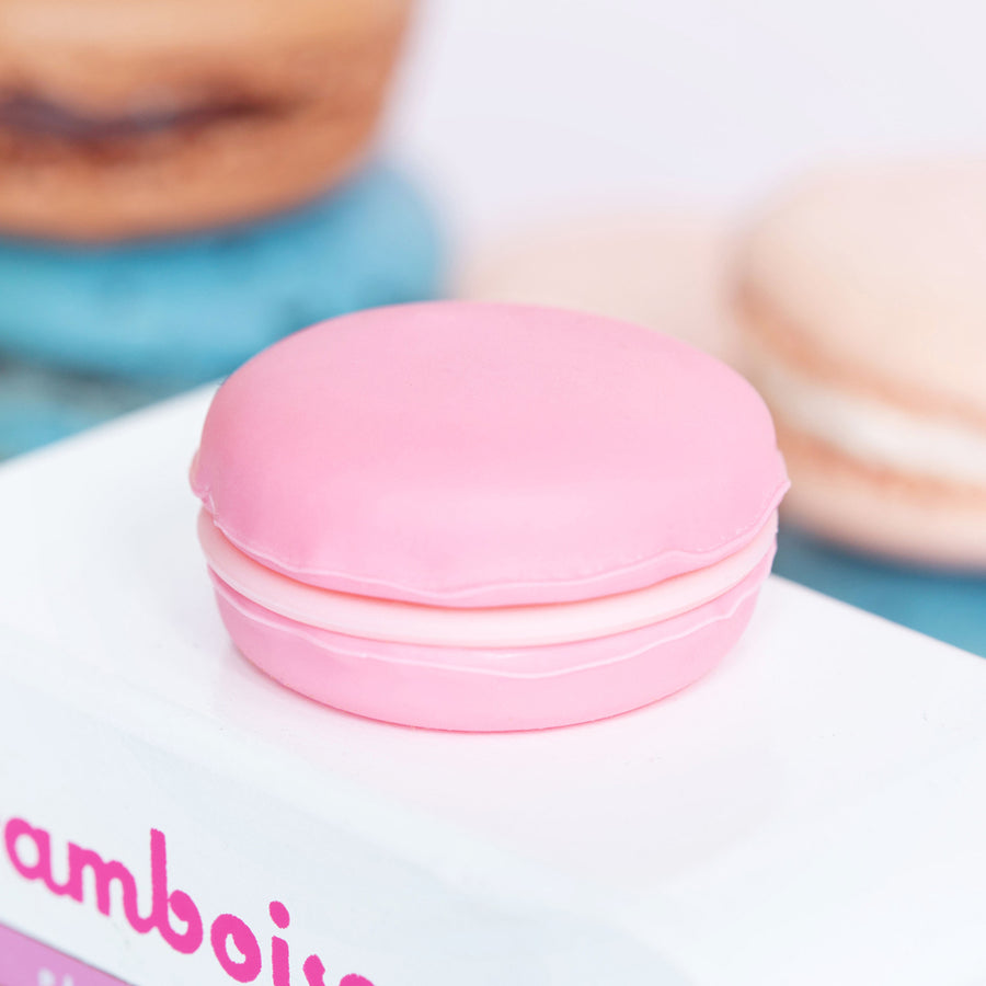 Picture of the large macaron that is on the roof of the Candyvan. It is pnik with a light pink filling.