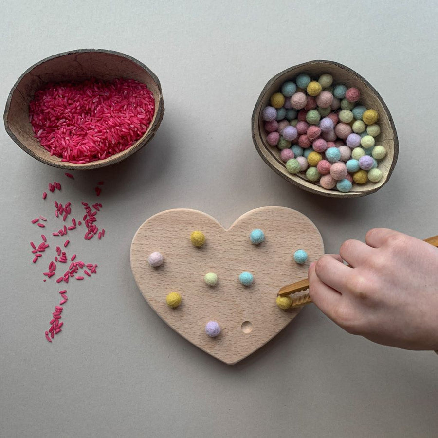 a number '3' card and a bowl of wooden loose parts.