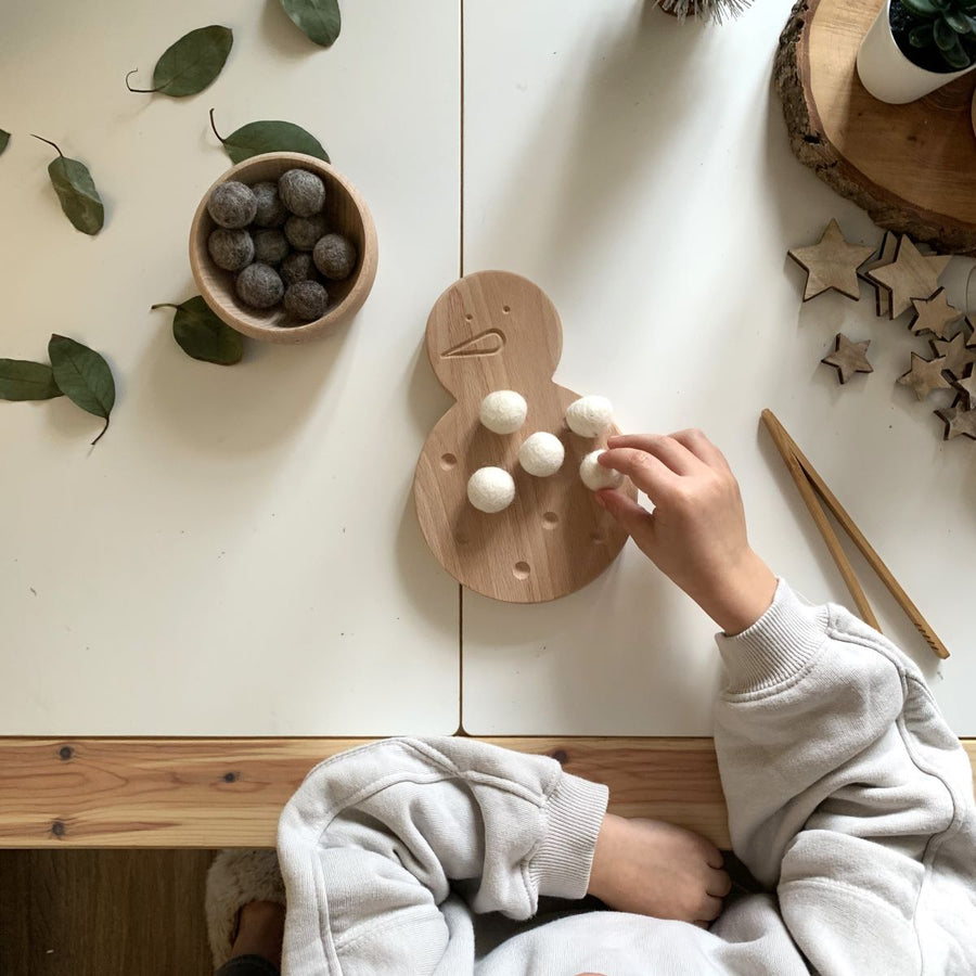 tweezers and Christmas themed loose parts.