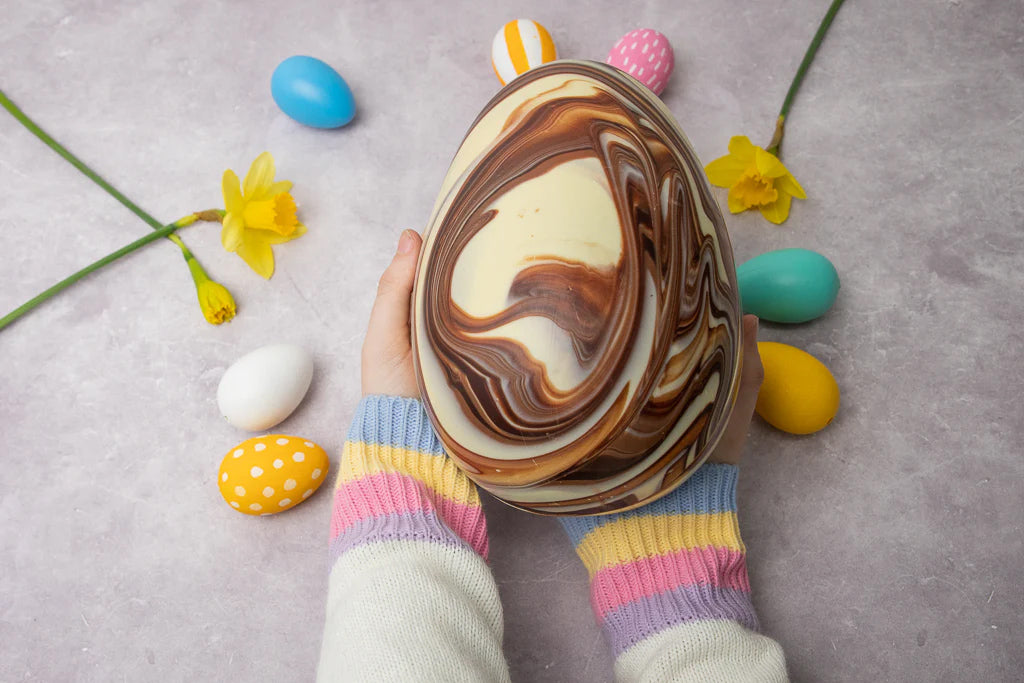 Cocoa Loco Cocoa Loco marbled fairtrade chocolate easter egg being held in a persons hand