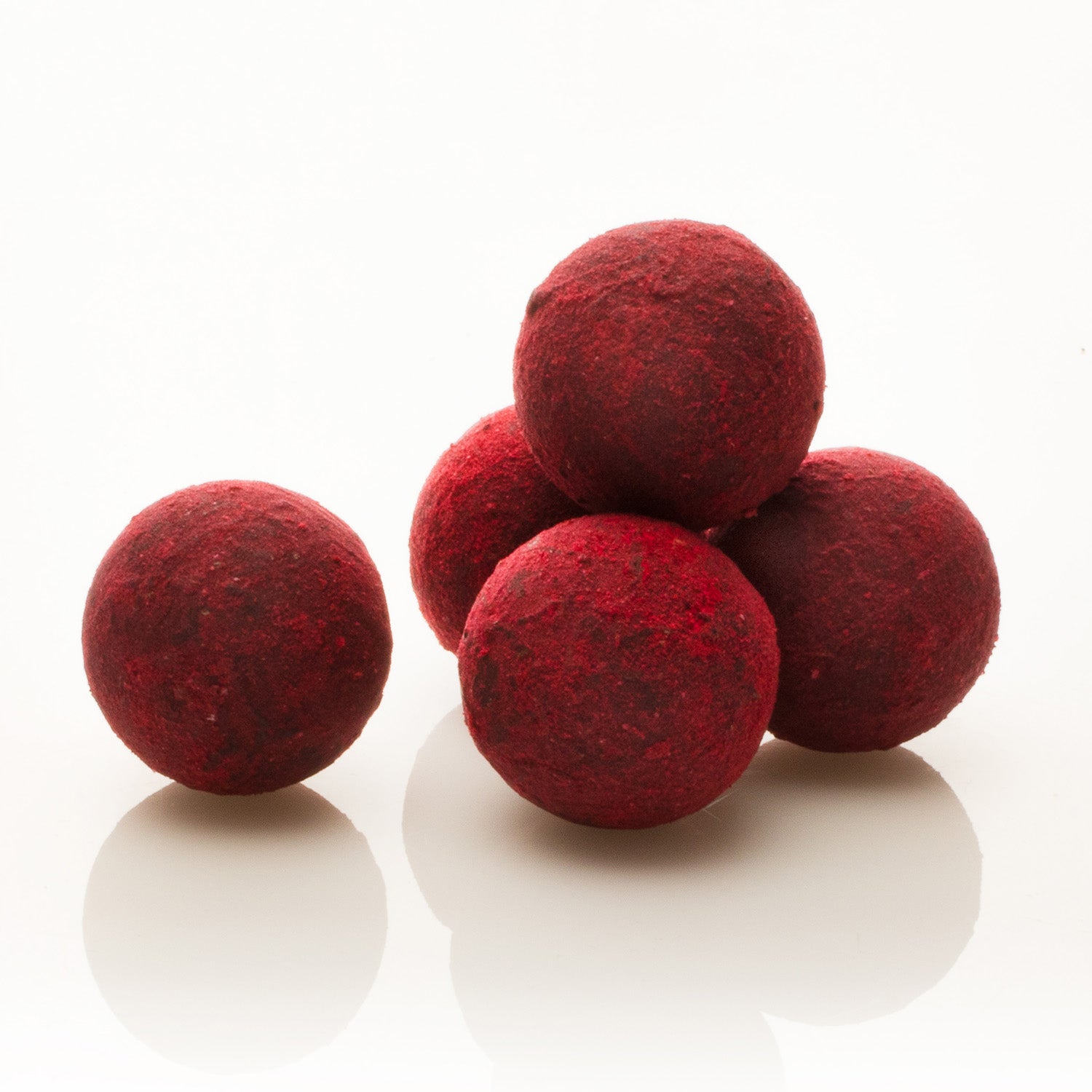 A person holding a box of Cocoa Loco Gin Truffles between their fingers