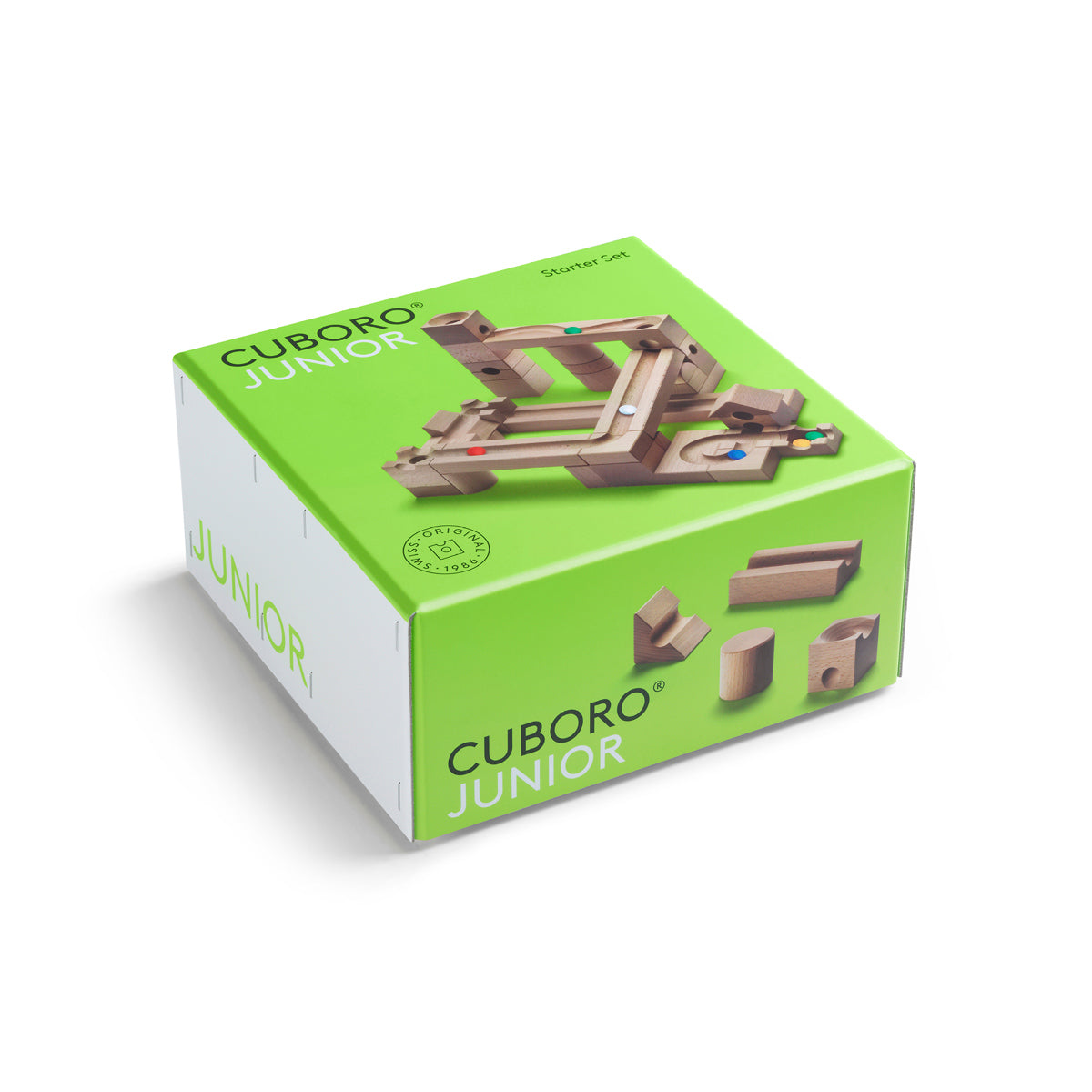 Green cardboard packaging for the Cuboro plastic-free Junior marble run kit on a white background