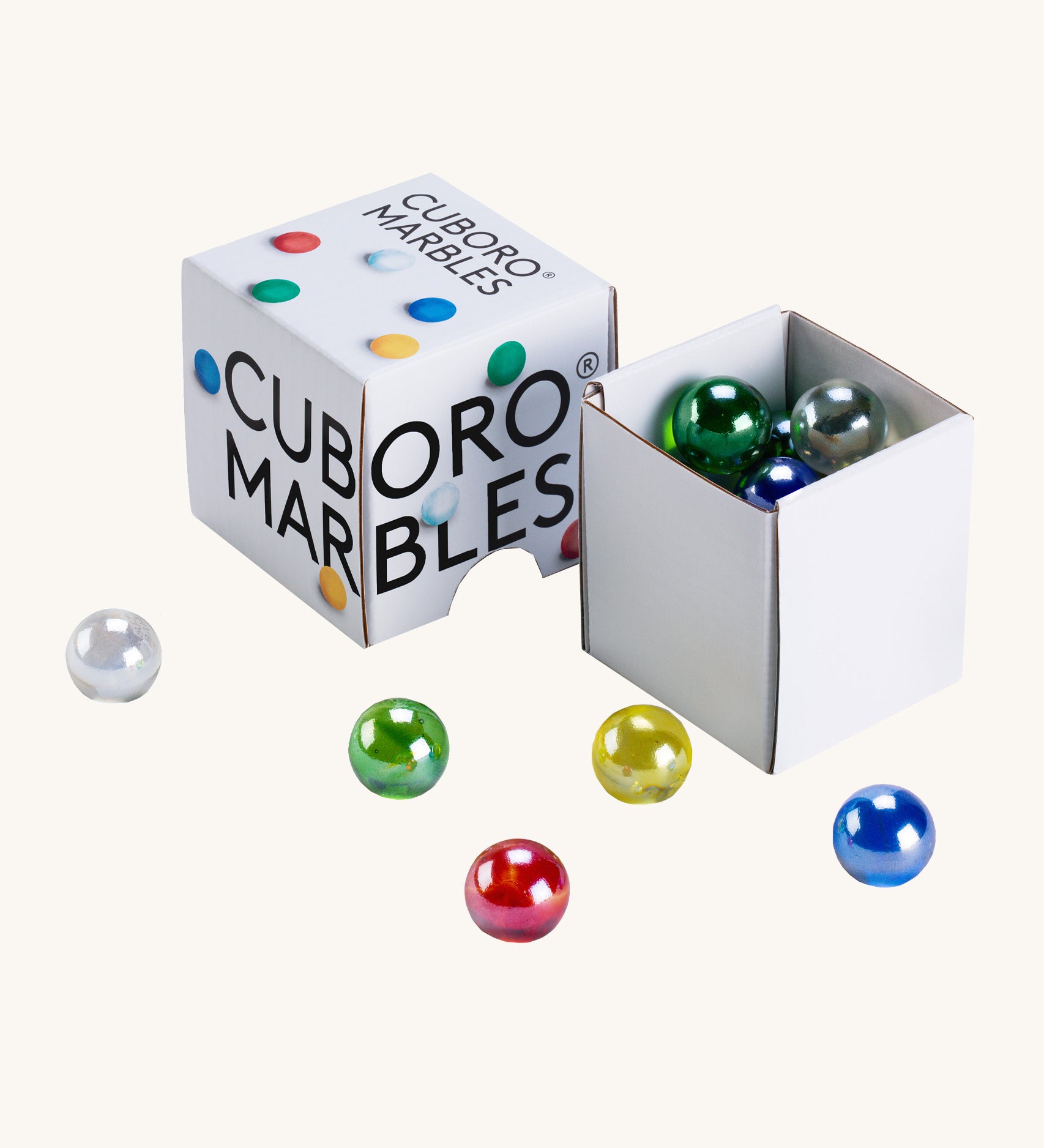 Cuboro 15 coloured glass marbles in their cardboard box on a cream background