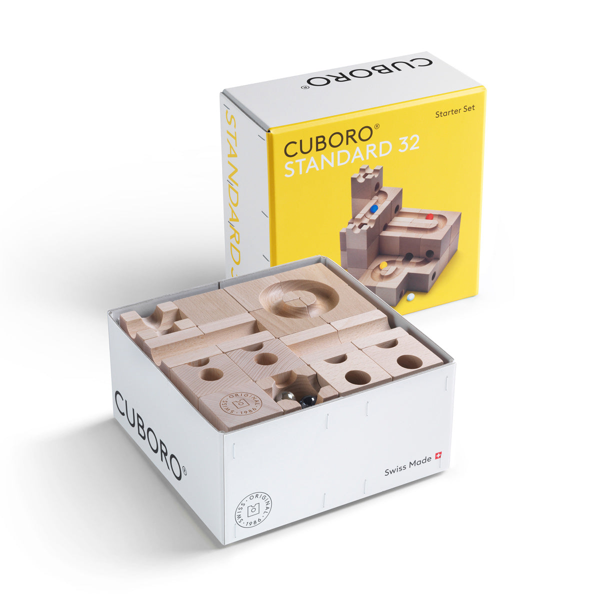 Cuboro Standard kids wooden marble run inside its cardboard box on a white background