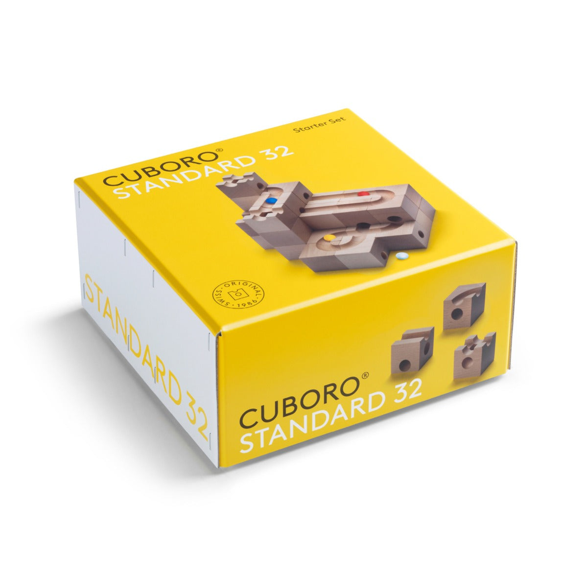 Yellow packaging for the Cuboro 32-piece standard marble run toy blocks on a white background