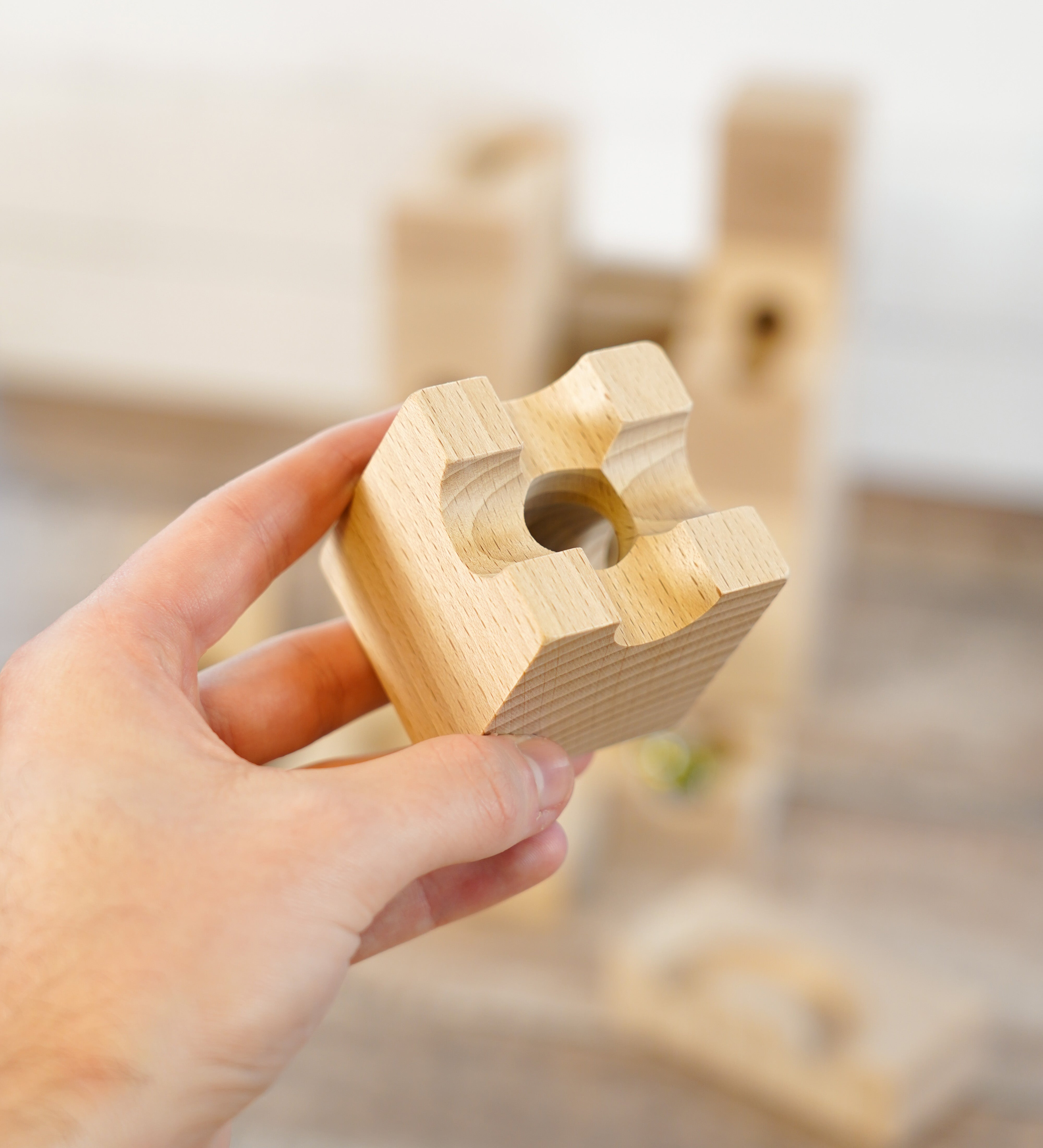 A close up of a wooden block from the Cuboro sub set.