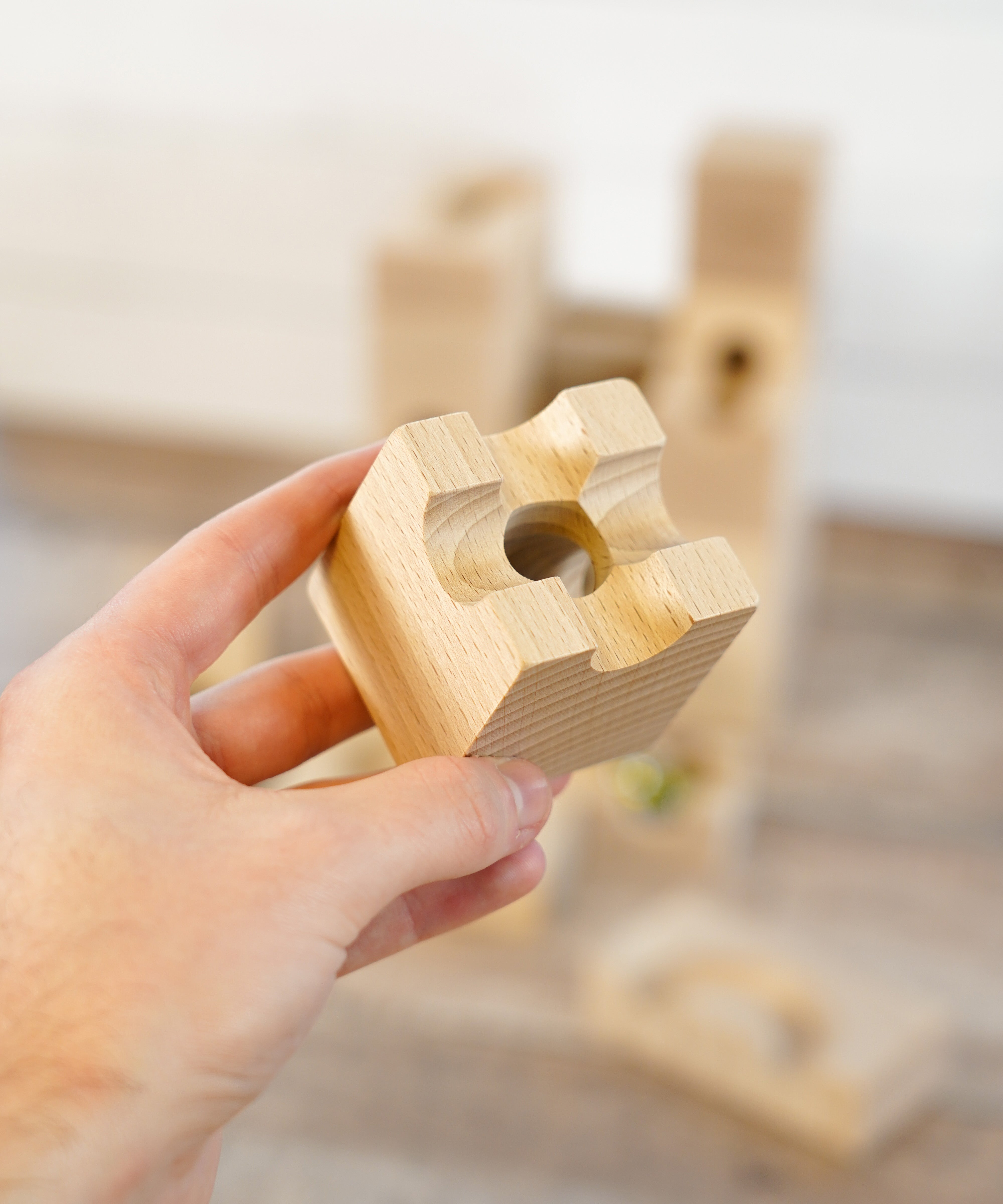 A close up of a wooden block from the Cuboro sub set.