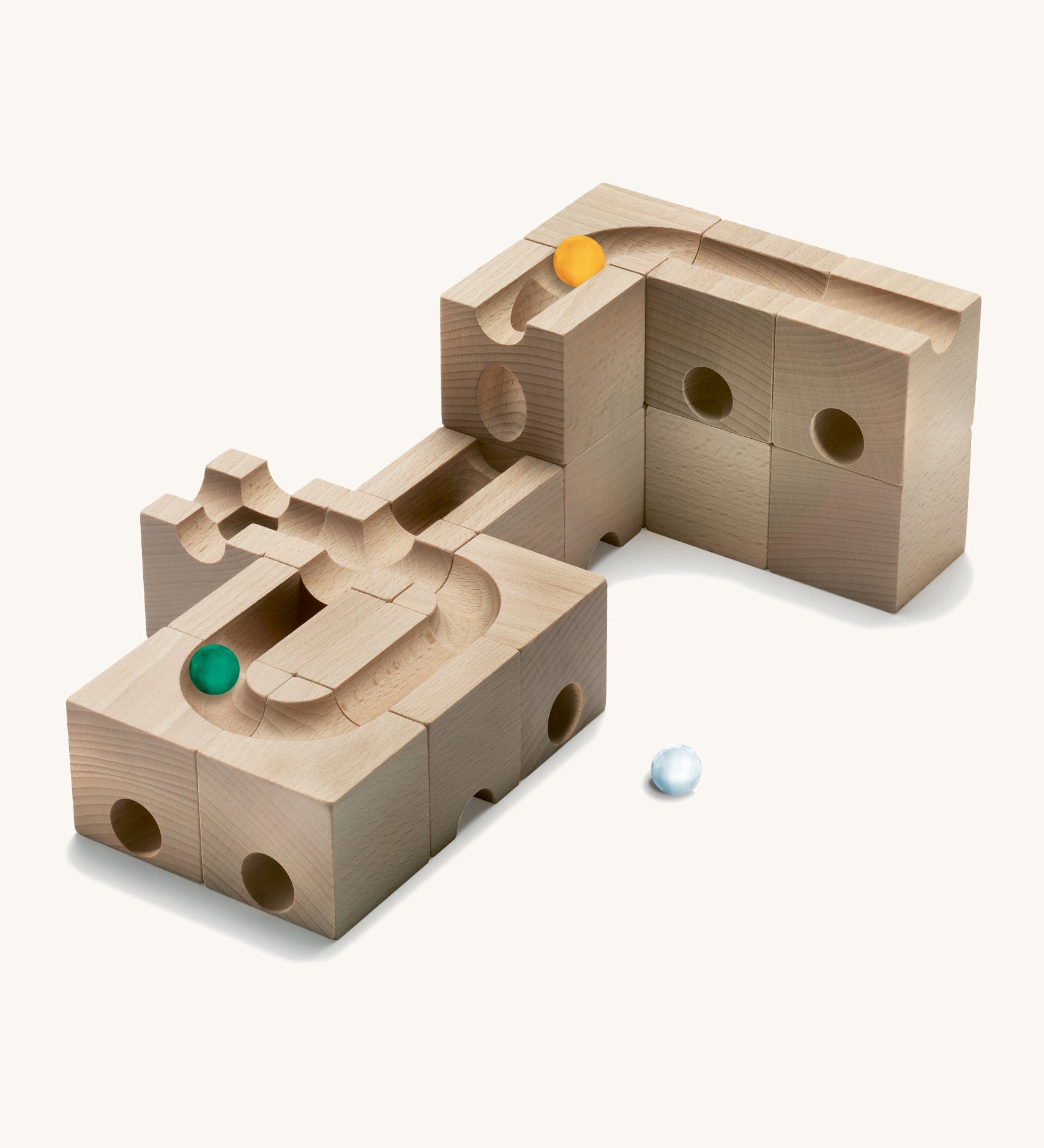 Cuboro kids wooden speed marble run accessory set laid out on a cream background