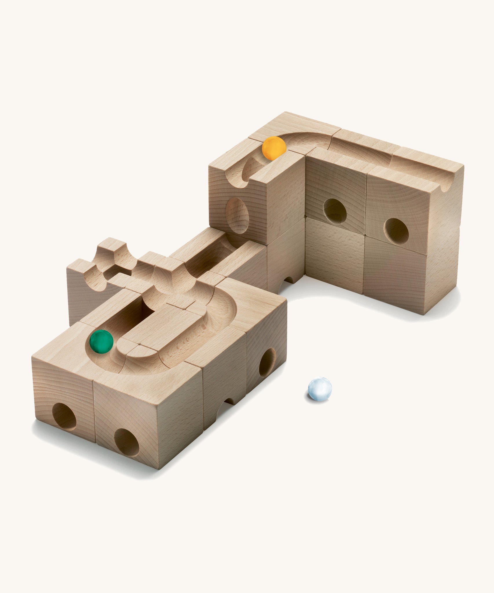 Cuboro kids wooden speed marble run accessory set laid out on a cream background