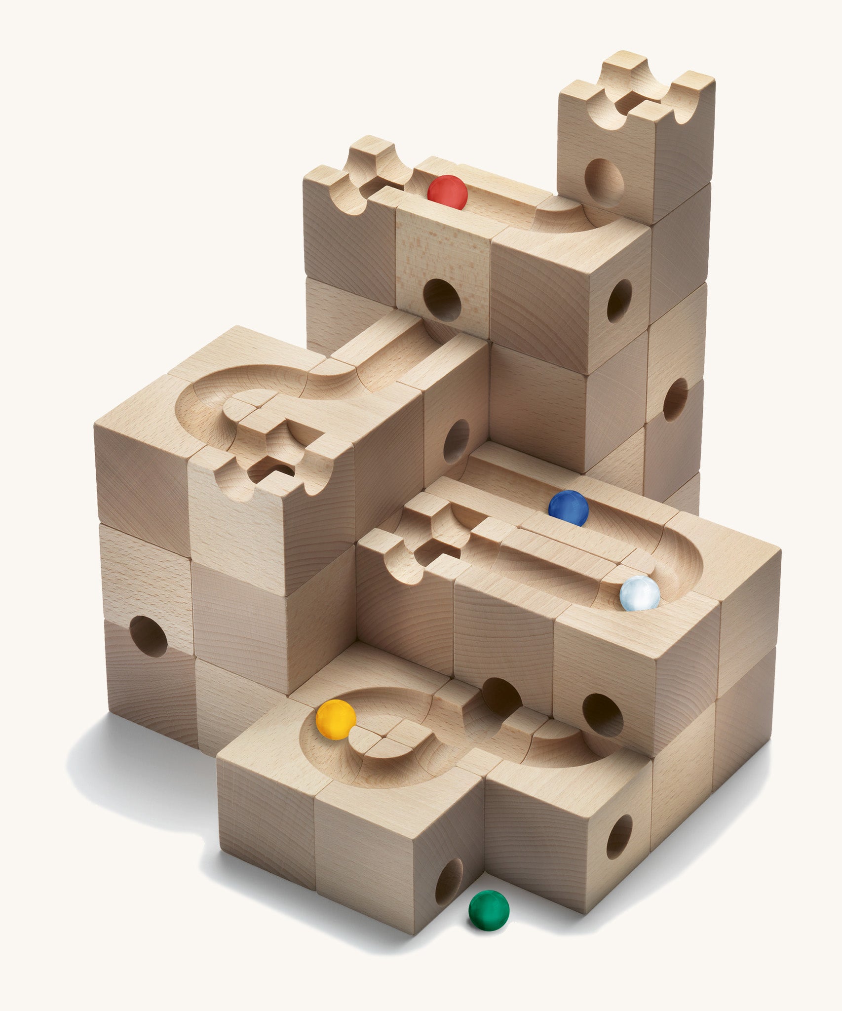 Cuboro kids plastic-free wooden marble run standard toy set stacked up on a white background