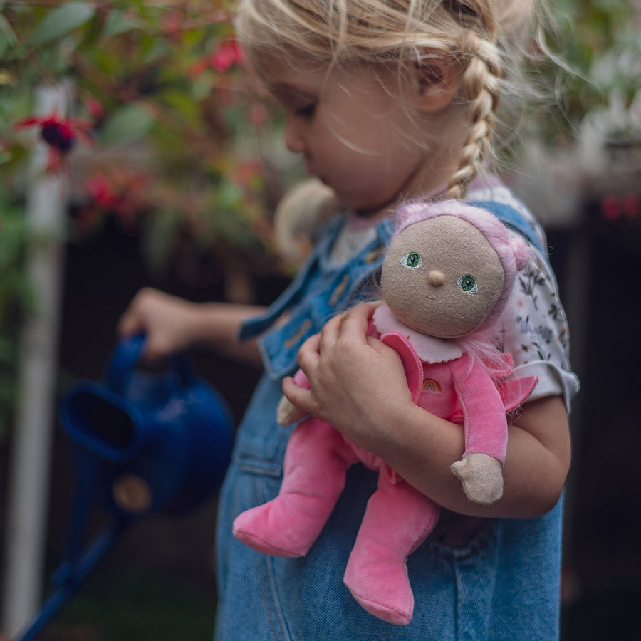 A child has set up a flower stall with fresh flowers and the full range of Olli Ella Dinky Dinkum Blossom Buds