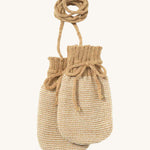 Disana organic merino wool baby mittens in light brown and natural colour on a cream background.