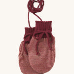 Disana organic merino wool baby mittens in light and dark purple on a cream background.