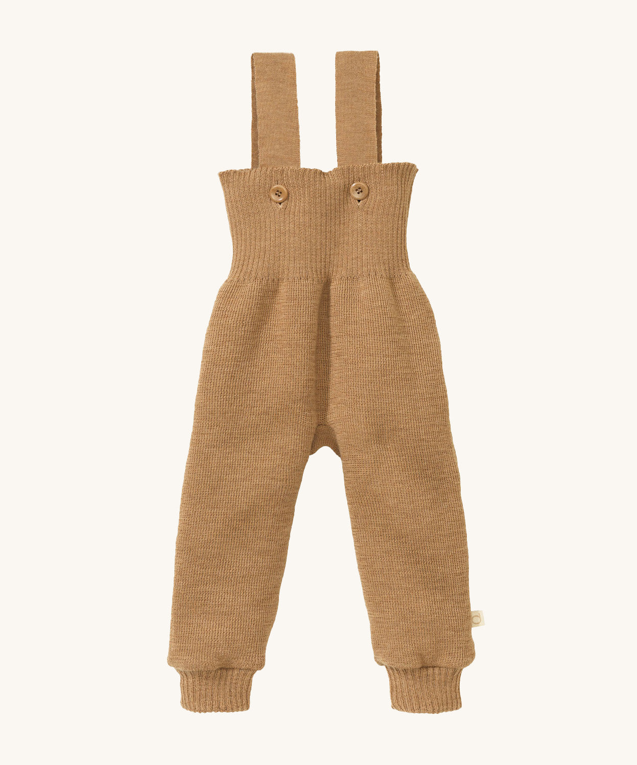 Disana organic merino wool dungarees in light brown on a cream background.