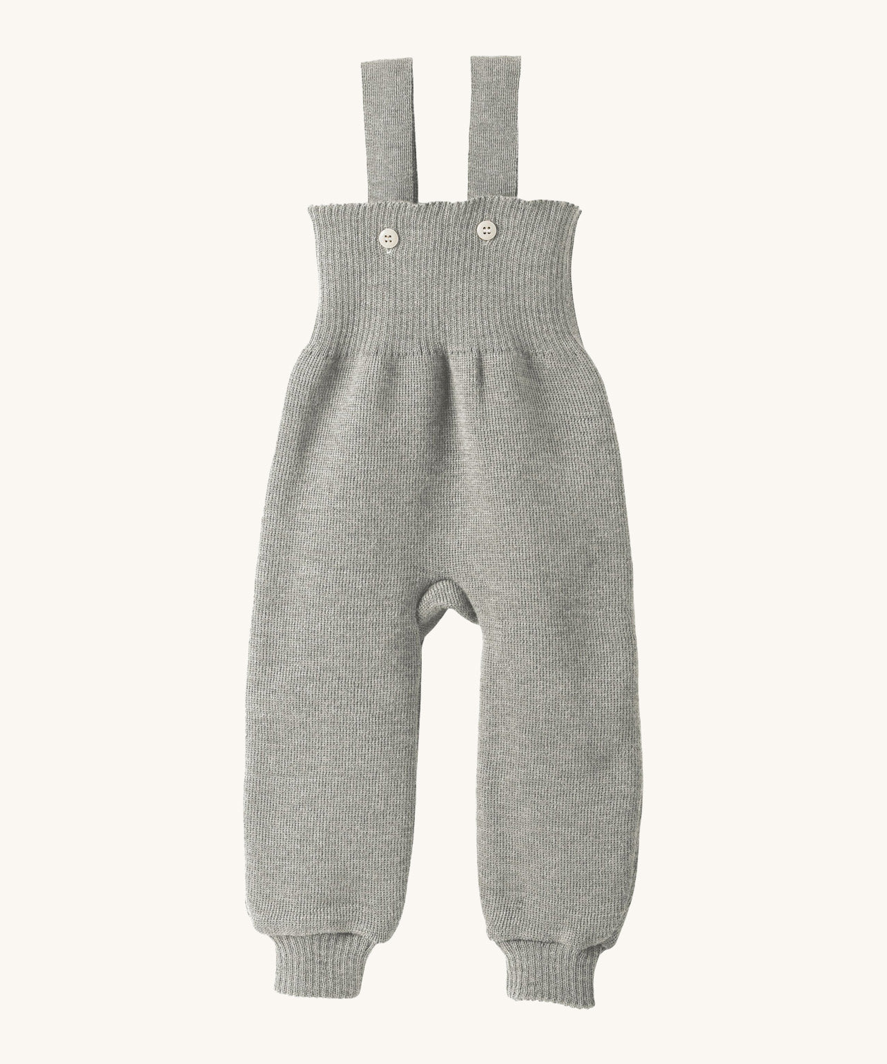 Disana organic merino wool dungarees in grey on a cream background.