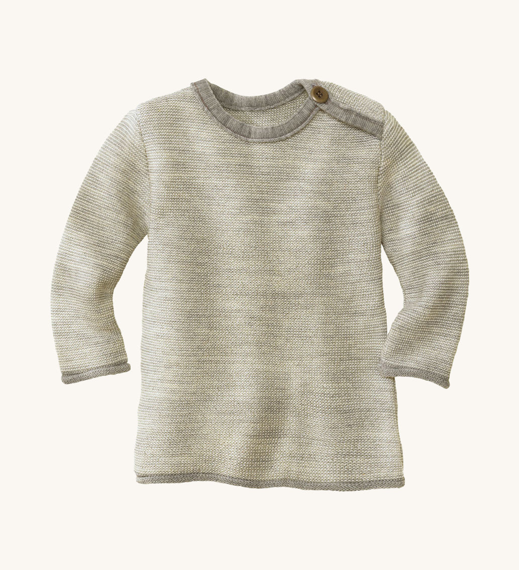 Disana organic merino wool melange jumper in a grey colour on a cream background.