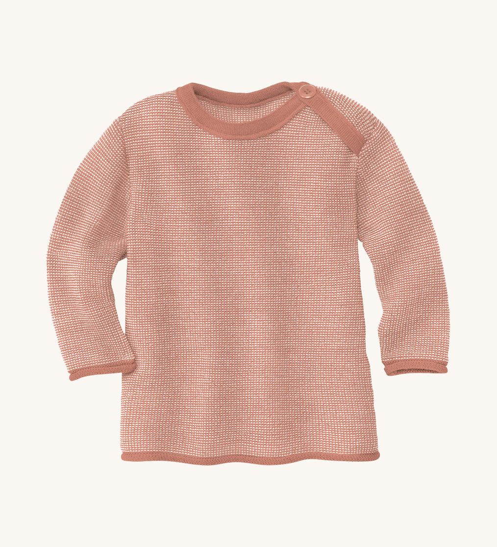 Disana organic merino wool melange jumper in a light pink colour on a cream background.