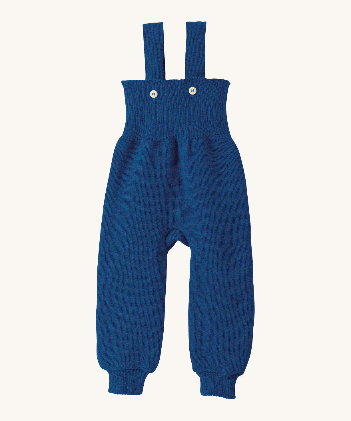 Disana organic merino wool dungarees in navy on a cream background.