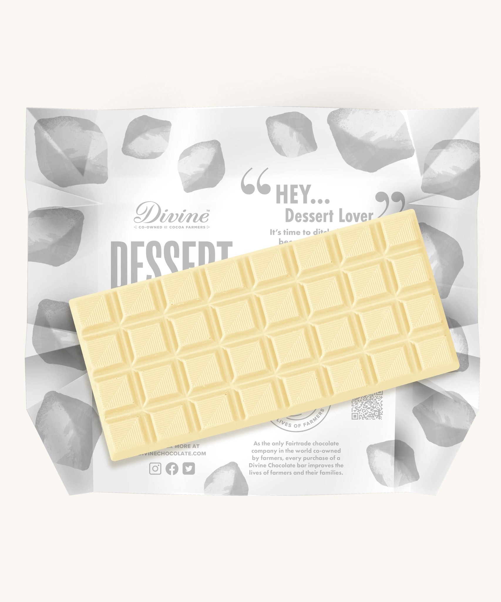 An unwrapped bar of the Divine White Chocolate Lemon Cheesecake Dessert Bar. 