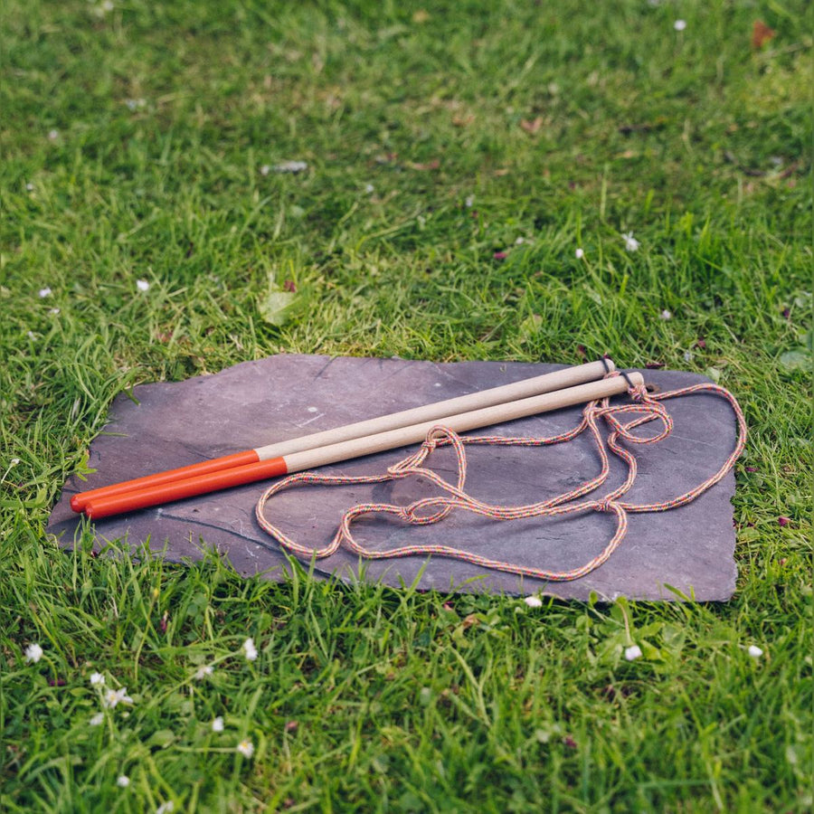 The Dr Zigs Mini Multi-Loop Lots of Bubbles Wand - 40cm on a slate in the grass