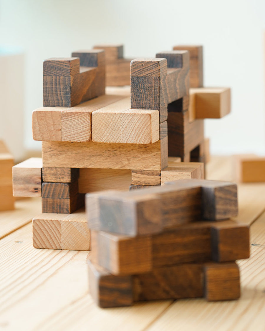 Close up of the Drei Blatter Chinter blocks stacked on a wooden background