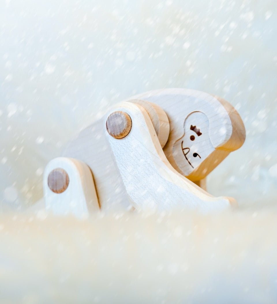 Close up of Bajo Tobe Yeti toy in a snowy scene