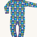 A light blue Duns babygrow with a light blue and light purple radish design on a cream background