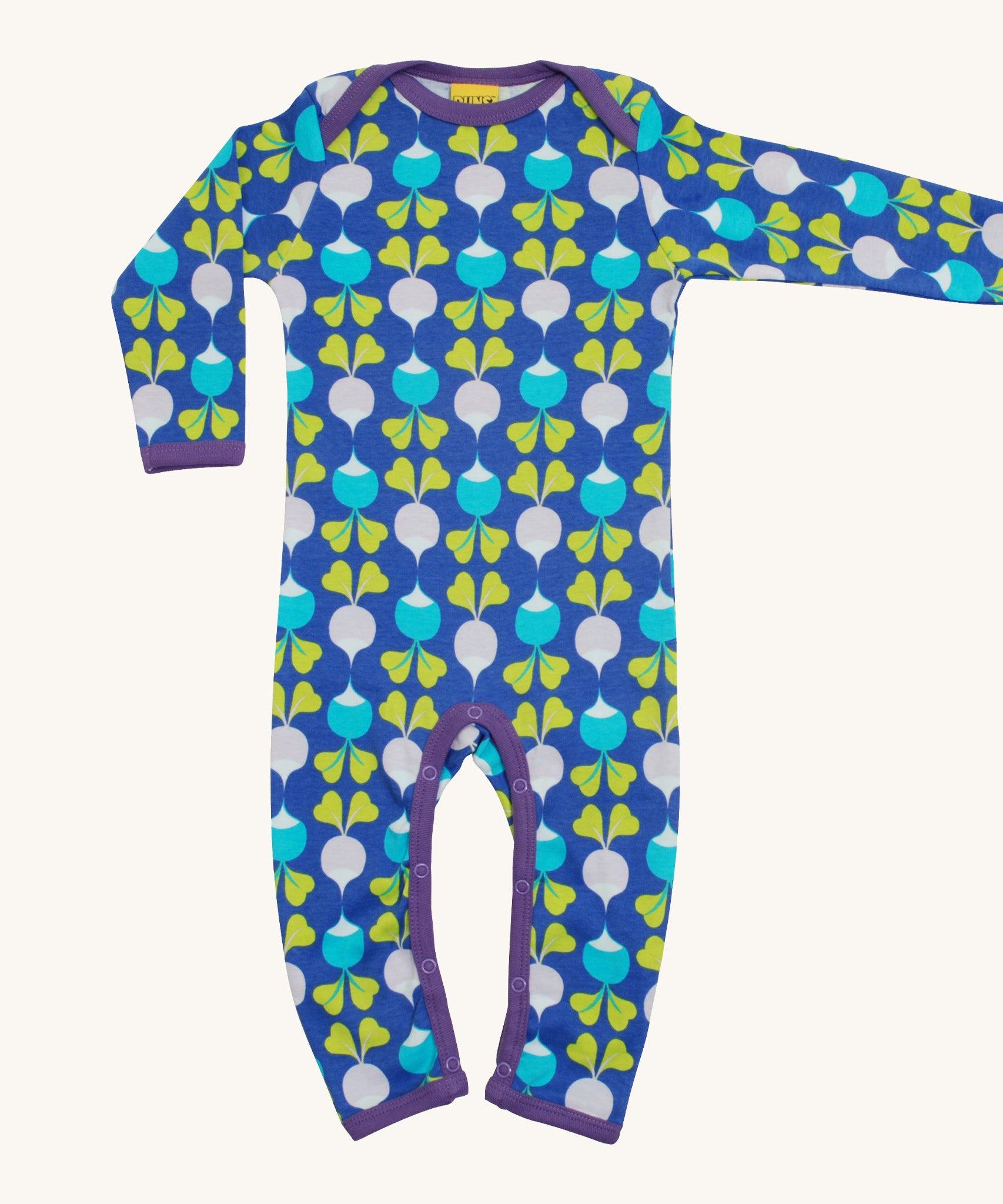 A light blue Duns babygrow with a light blue and light purple radish design on a cream background