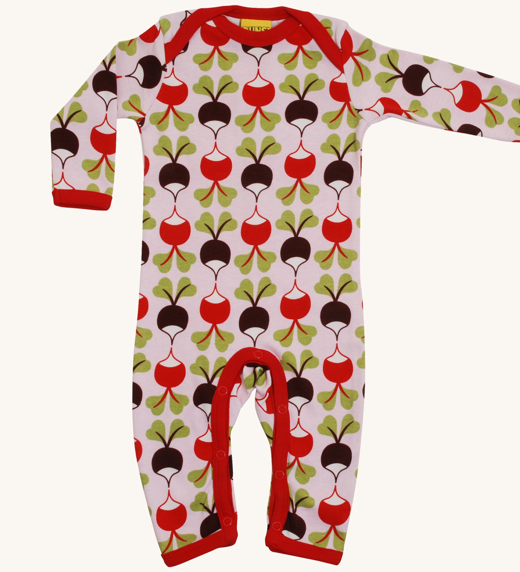 A light pink Duns babygrow with a red and brown radish design on a cream background