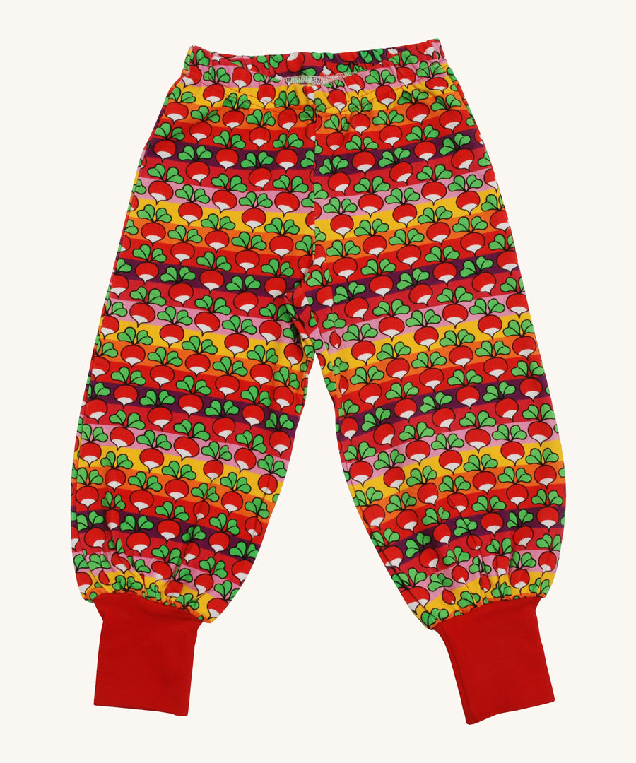 A orange, red, pink and purple striped Duns baggy pants with a radish design on a cream background.