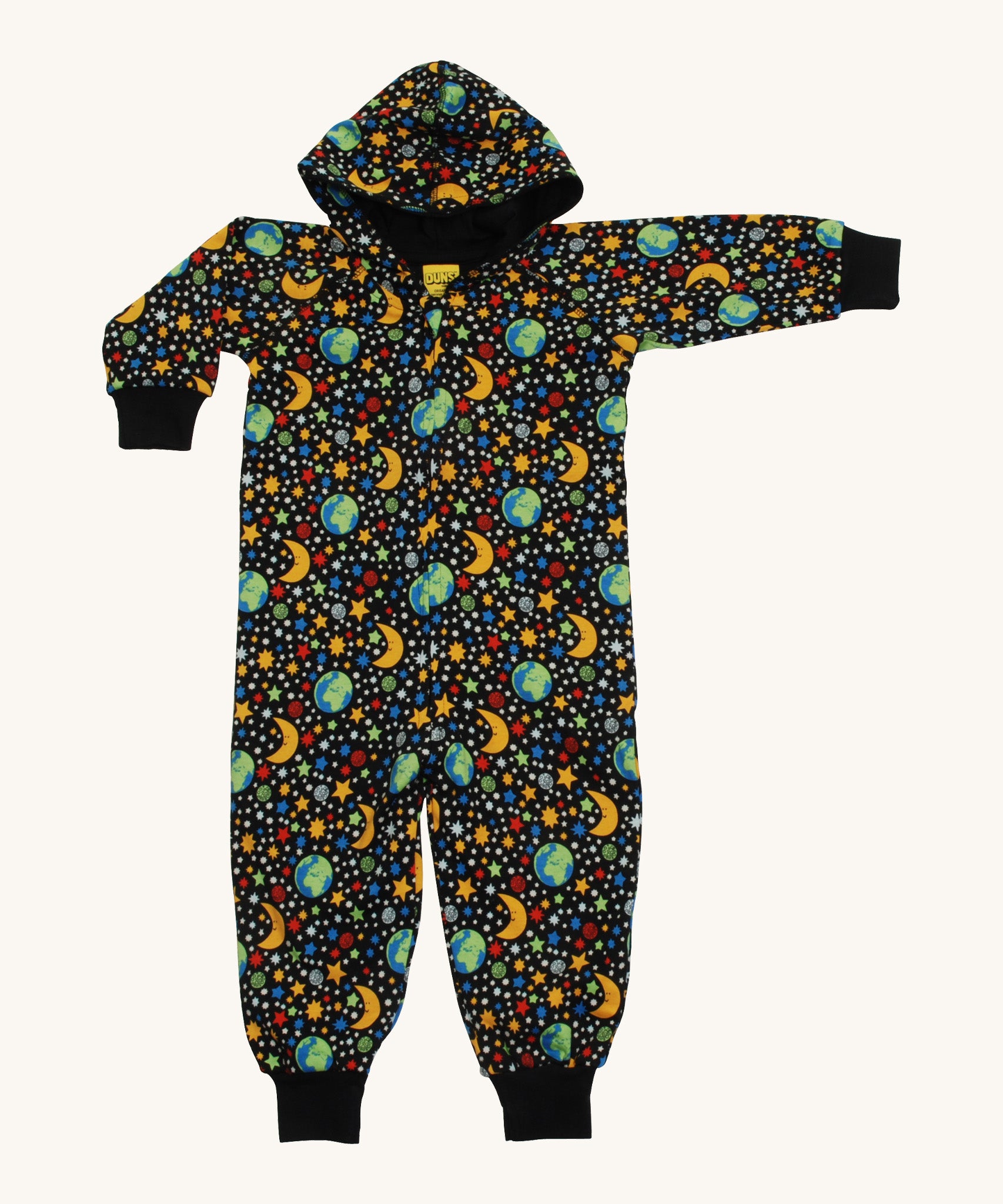 A black Duns hooded onesie with the earth, the moon and stars design on a cream background