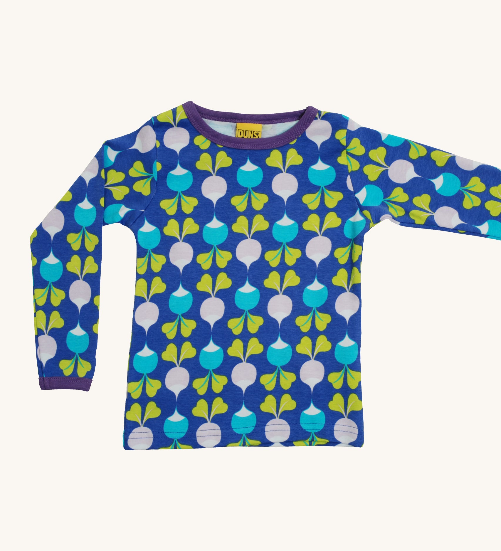 A light blue Duns long sleeve top with a light blue and light purple radish design on a cream background