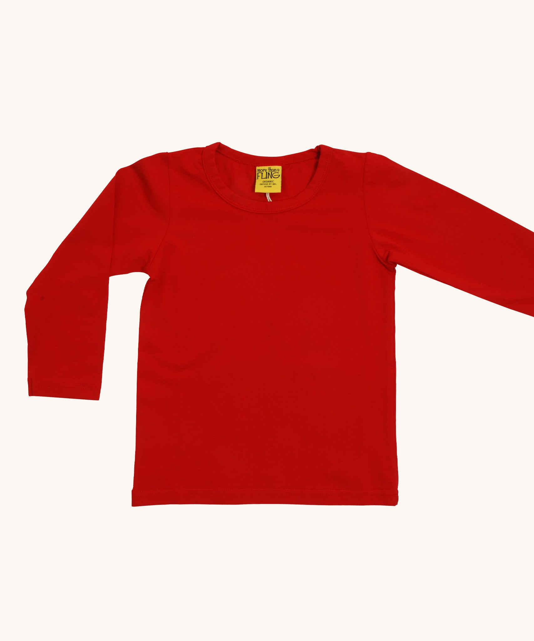 A red Duns long sleeve top on a cream background.