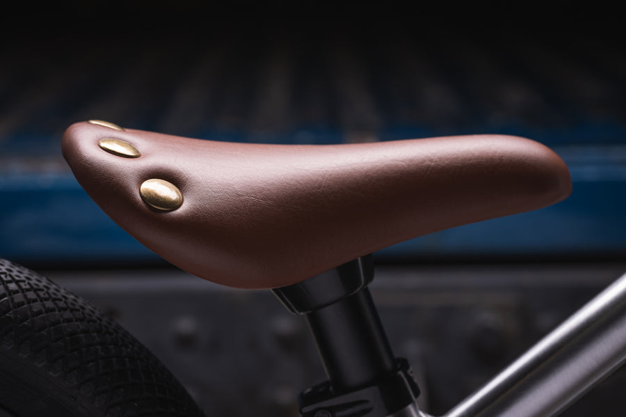 Close up of the brown seat on the Early Rider childrens charger balance bike